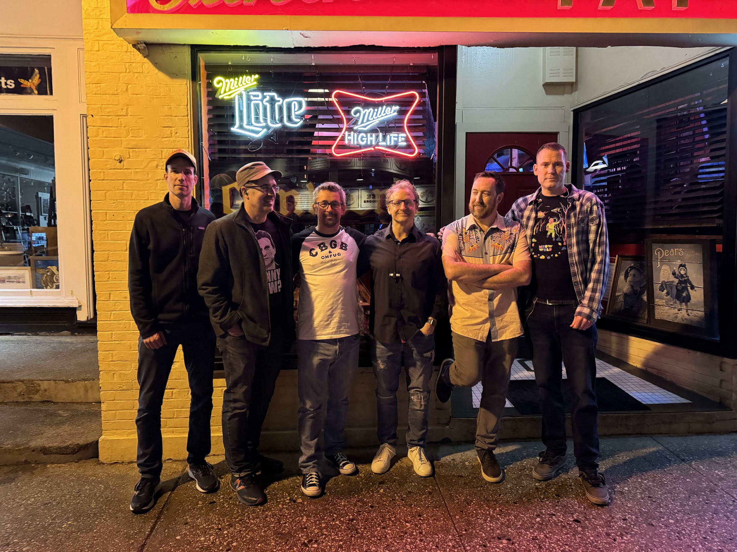 The Passables outside a bar at night